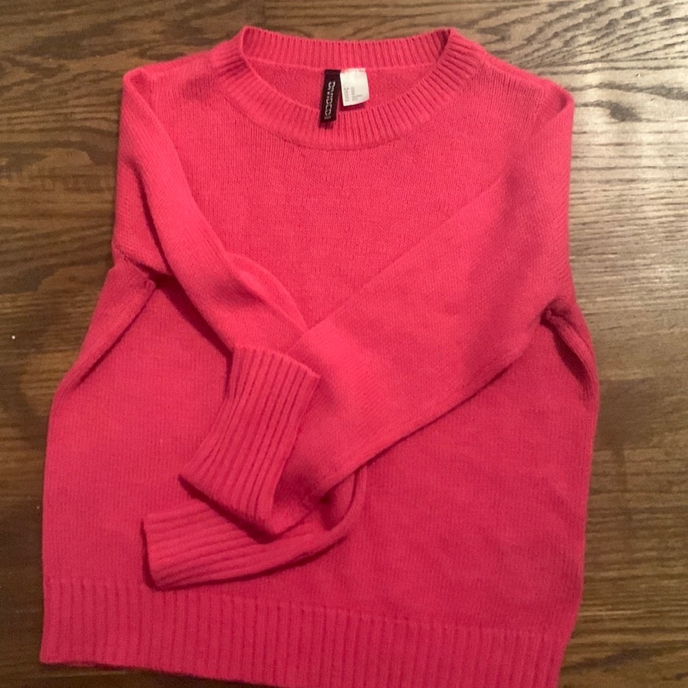 I am Selling, a pink knit sweater in a size XS.